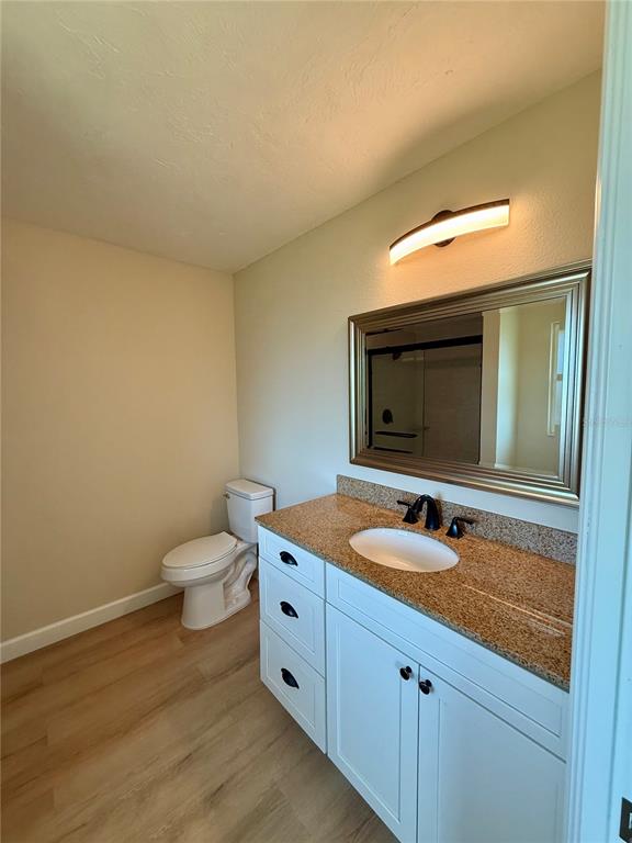 3541 65th Ave Circle East Sarasota, FL 34243 - Photo 12 of 17 a bathroom with a granite countertop sink and a mirror