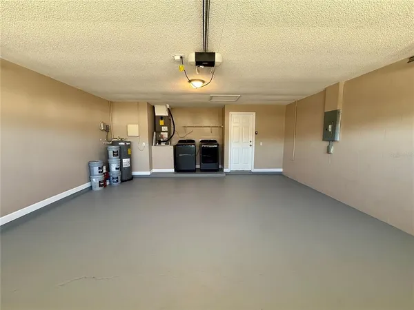 an empty room with furniture and a fireplace