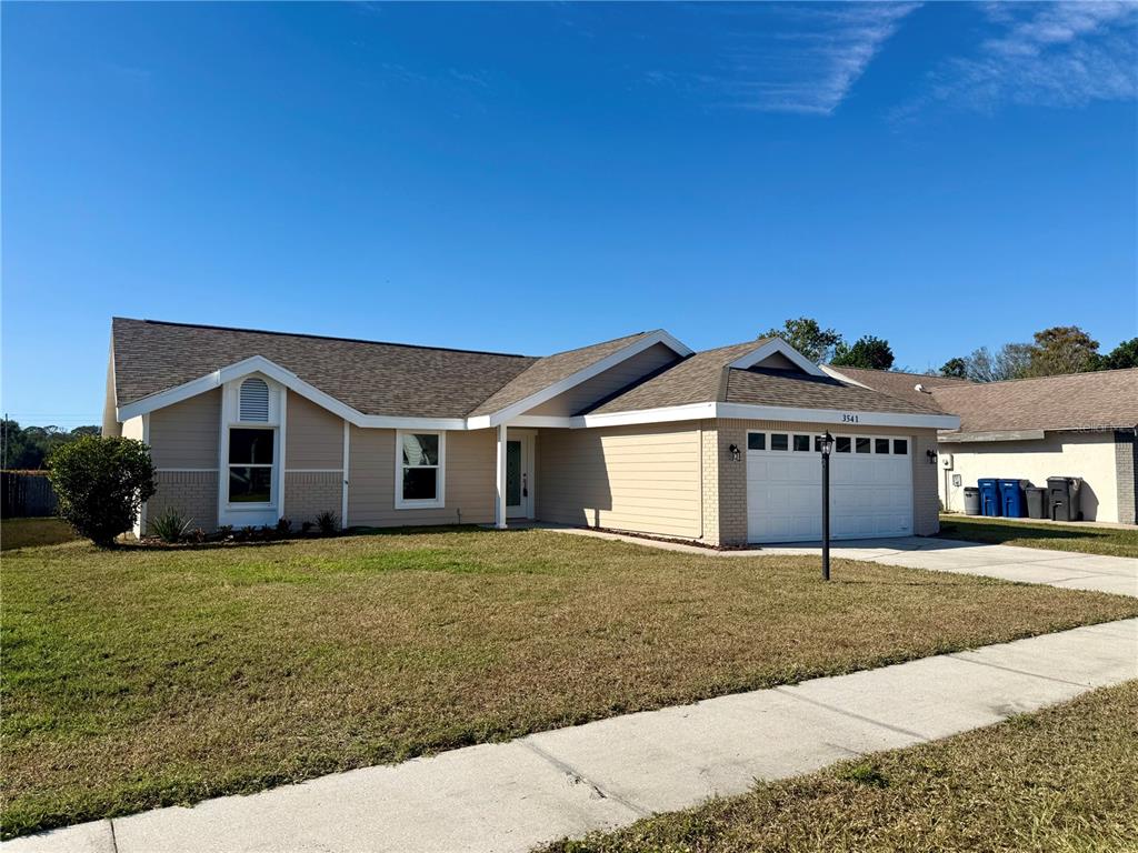 3541 65th Ave Circle East Sarasota, FL 34243 - Photo 2 of 17 a house that has a big yard
