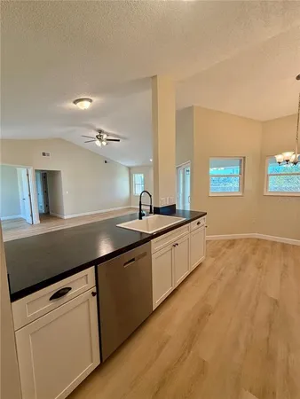 a kitchen with a sink and cabinets