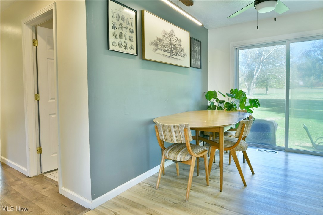 4400 Ridge Road Cortland, OH 44410 - Photo 25 of 50 Dining room featuring light wood-style flooring and a ceiling fan
