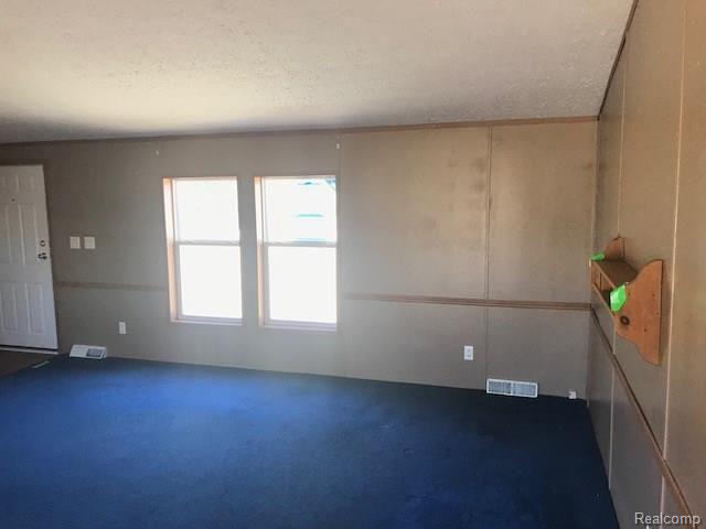 8227 North Center Road Mount Morris, MI 48458 - Photo 8 of 34 living 2.jpeg