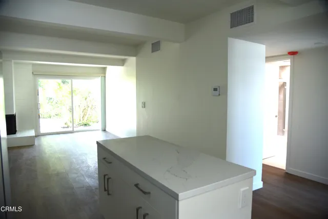 a view of storage and utility room with window