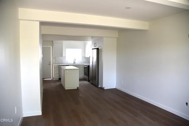 a view of a kitchen cabinets and a wooden floor