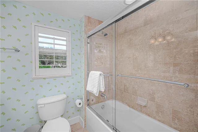 a bedroom with a bed and chair