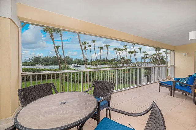 a view of a balcony with furniture