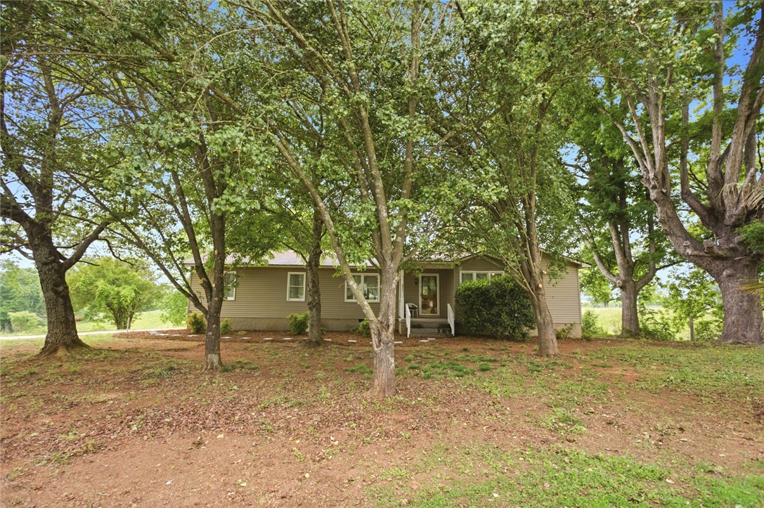 2001 Highway 59 Westminster, SC 29693 - Photo 1 of 38 Charming home nestled amongst mature trees, offering a serene and private setting.