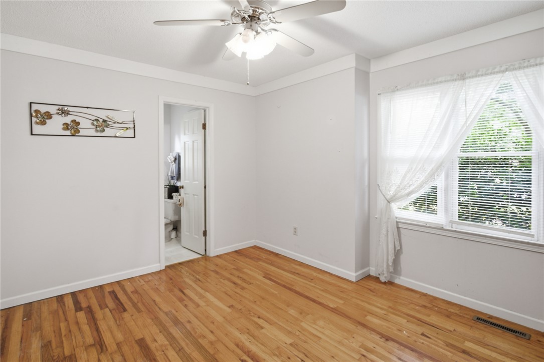 2001 Highway 59 Westminster, SC 29693 - Photo 19 of 38 This spacious bedroom offers gleaming hardwood floors and ample natural light through its large window.