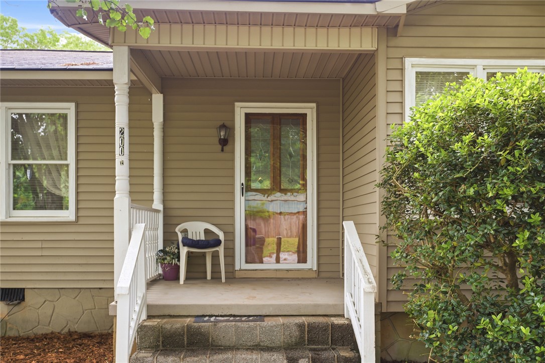 2001 Highway 59 Westminster, SC 29693 - Photo 2 of 38 Welcome home to this inviting facade with a charming front porch, perfect for greeting guests.