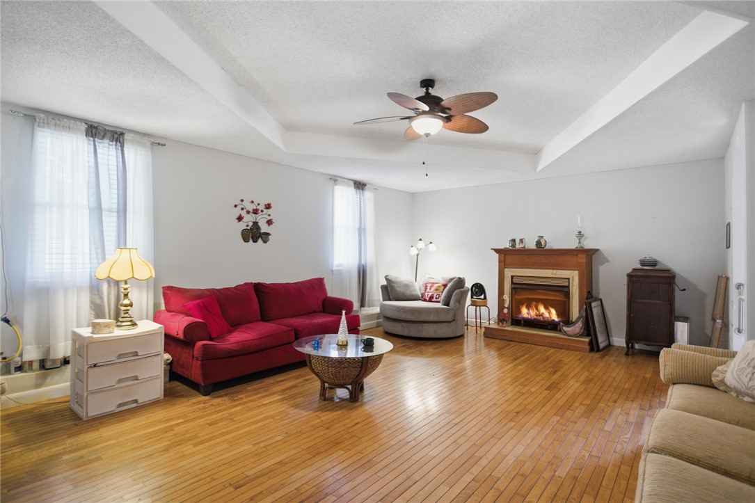 2001 Highway 59 Westminster, SC 29693 - Photo 28 of 38 This inviting living space features warm hardwood floors and a cozy fireplace, perfect for relaxation.