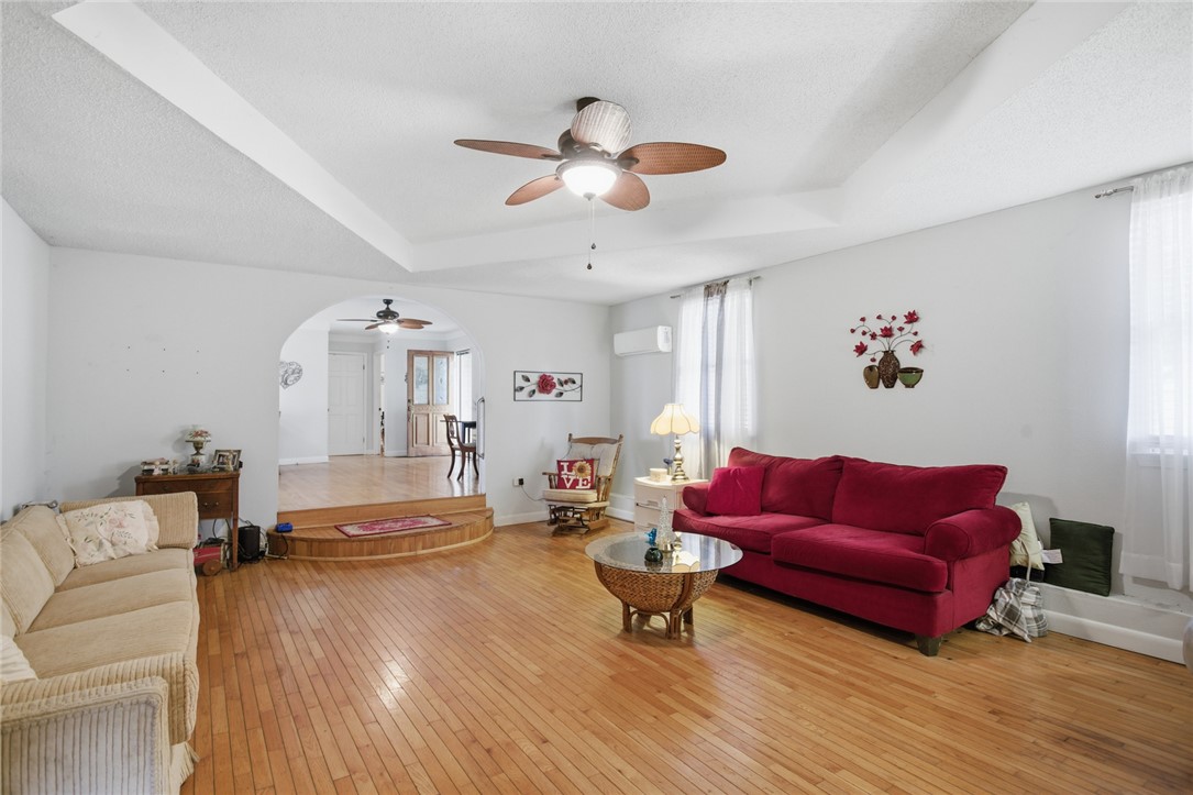 2001 Highway 59 Westminster, SC 29693 - Photo 30 of 38 This living area features a warm ambiance with rich hardwood flooring and a functional ceiling fan.
