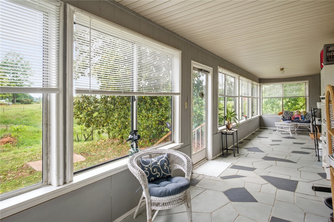 2001 Highway 59 Westminster, SC 29693 - Photo 32 of 38 This bright sunroom offers expansive views, creating an inviting indoor-outdoor retreat.