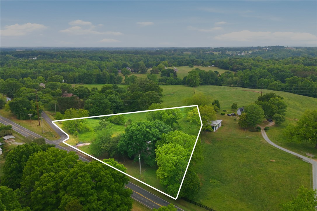 2001 Highway 59 Westminster, SC 29693 - Photo 36 of 38 Expansive green acreage awaits, featuring mature trees and clear, buildable land.