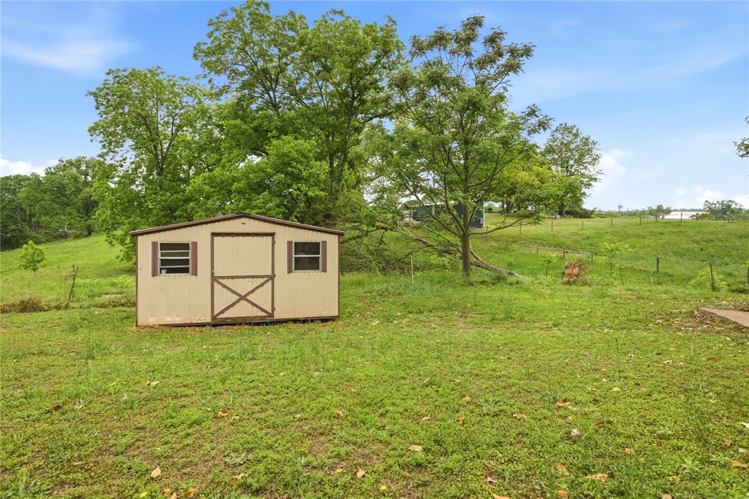 2001 Highway 59 Westminster, SC 29693 - Photo 6 of 38 This expansive yard features a convenient storage shed, nestled amongst mature trees and rolling green hills.