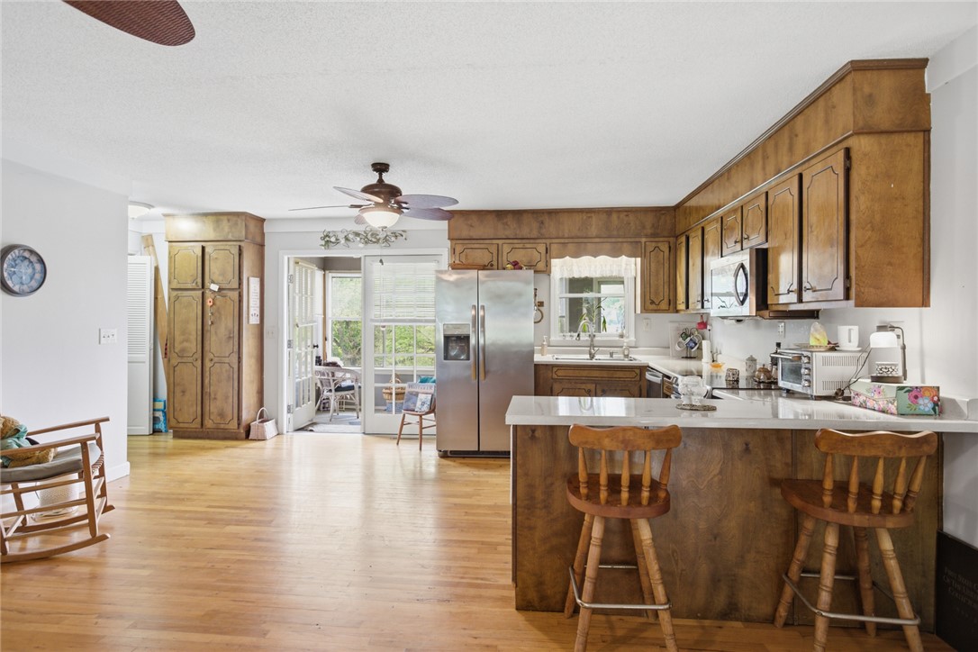 2001 Highway 59 Westminster, SC 29693 - Photo 10 of 38 This bright kitchen features wood flooring and a breakfast bar, perfect for casual dining and entertaining.