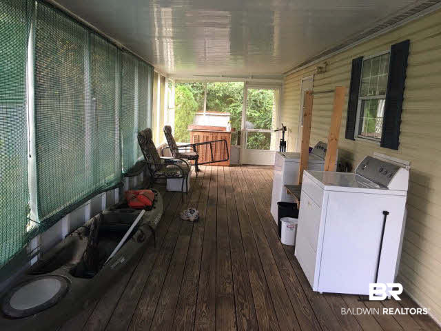 155 Defuniak Loop Lillian, AL 36549 - Photo 7 of 12 Screened porch.