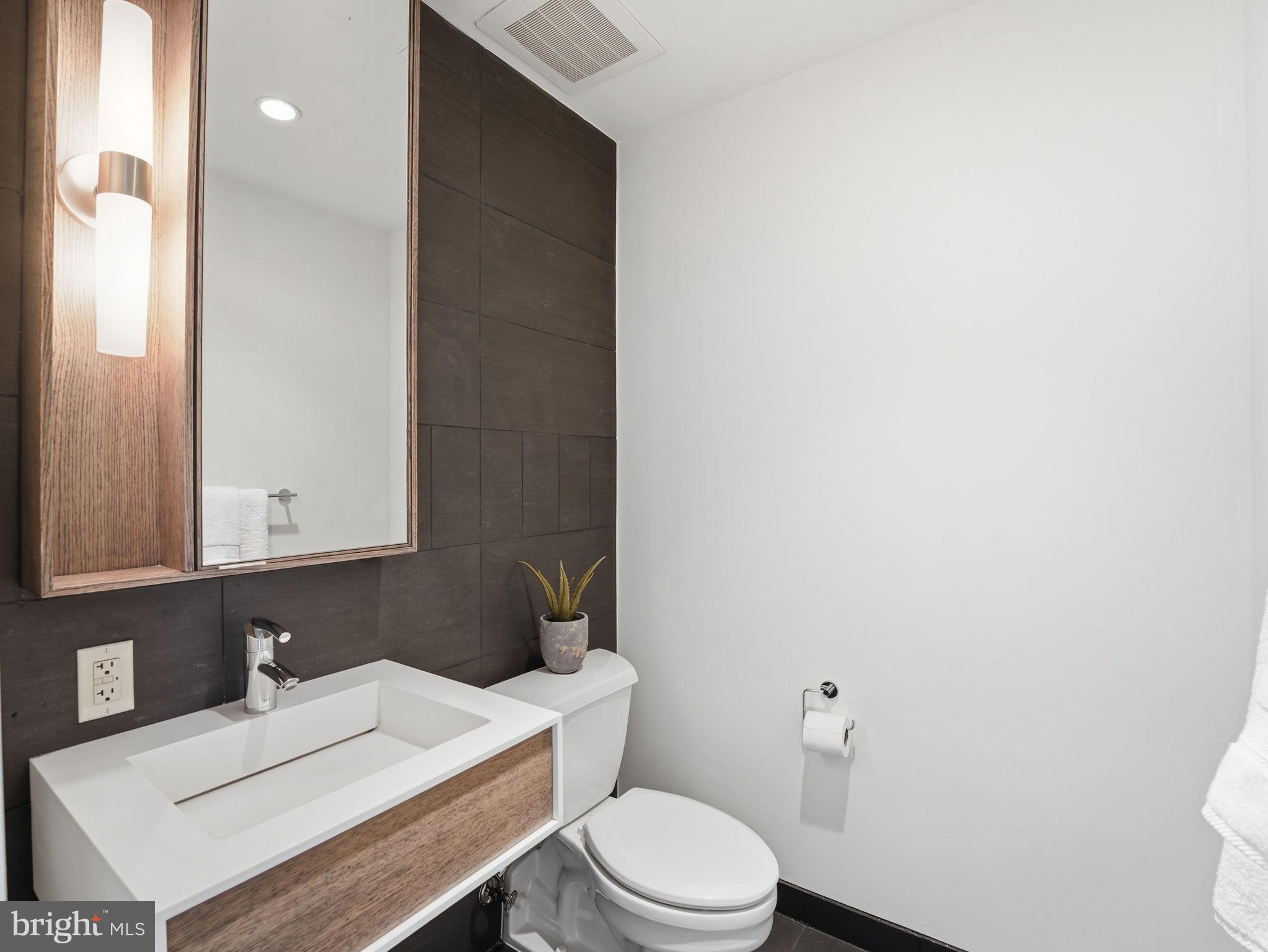 1515 15th Street Northwest, Unit 401 Washington, DC 20005 - Photo 26 of 37 Half Bath, Main Floor