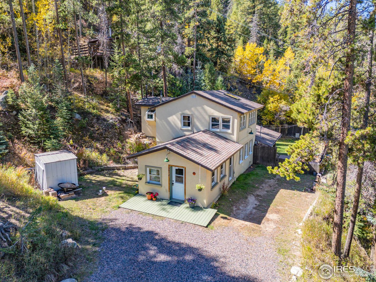 3072 Highway 72 Black Hawk, CO 80422 - Photo 34 of 36 a front view of a house with a garden and trees