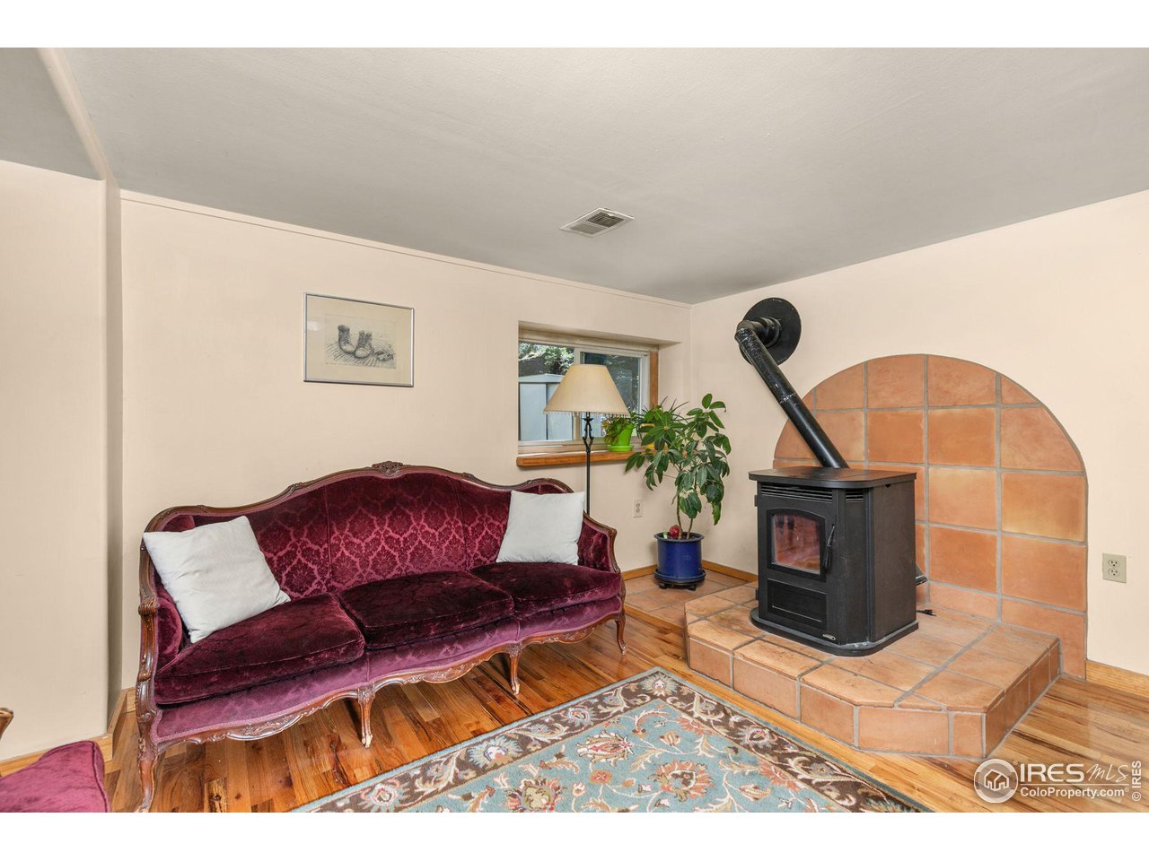 3072 Highway 72 Black Hawk, CO 80422 - Photo 10 of 36 a living room with furniture a rug and a fireplace