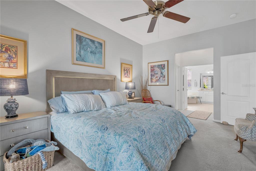 19015 Fern Meadow Loop Lutz, FL 33558 - Photo 22 of 50 a bedroom with a bed and a painting on the wall