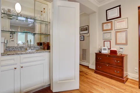 a room with a dresser and a mirror