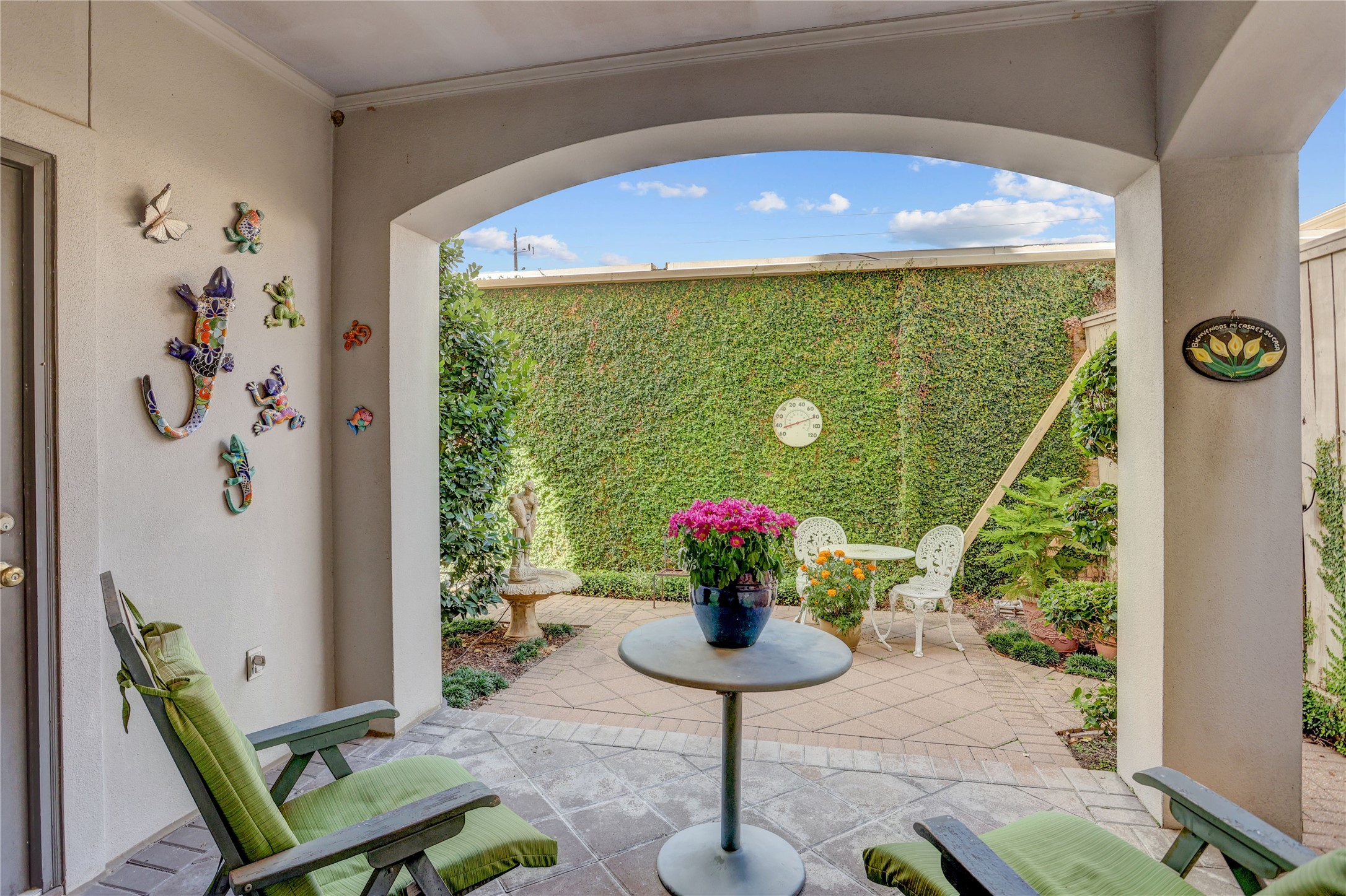 1008 Potomac Drive Houston, TX 77057 - Photo 14 of 34 a vase with flowers sitting on a table in front of a window