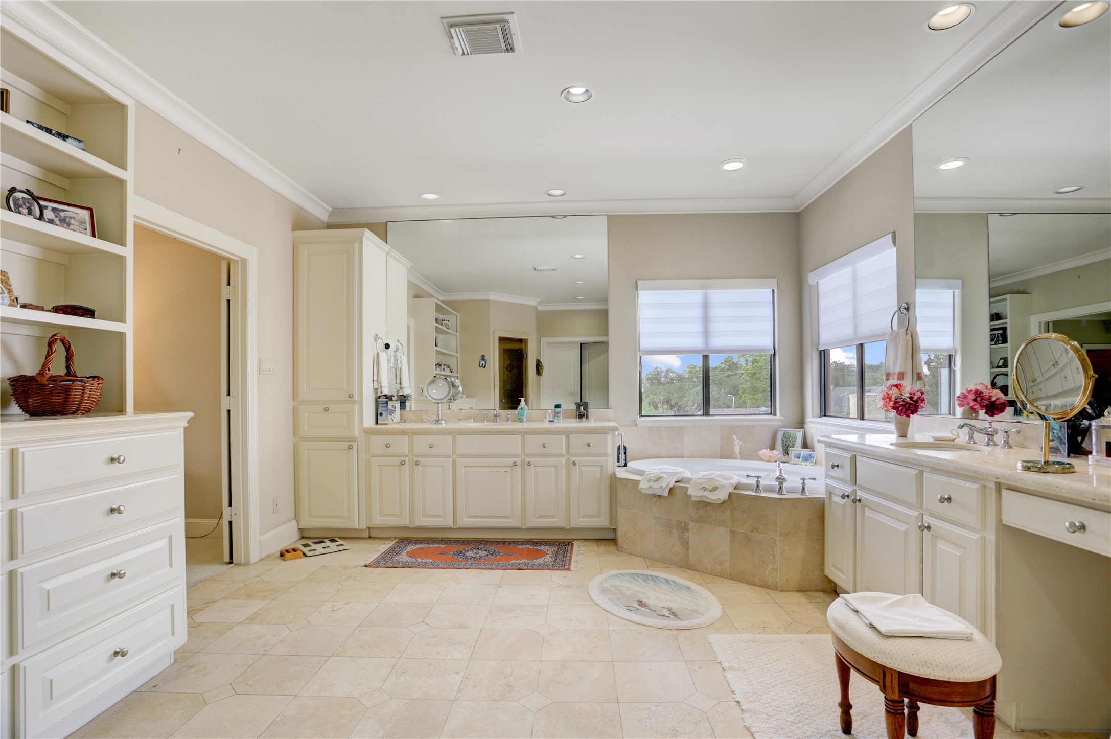 1008 Potomac Drive Houston, TX 77057 - Photo 27 of 34 a large white kitchen with white cabinets and stove