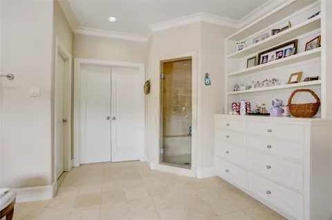 a view of walk in closet with clothes