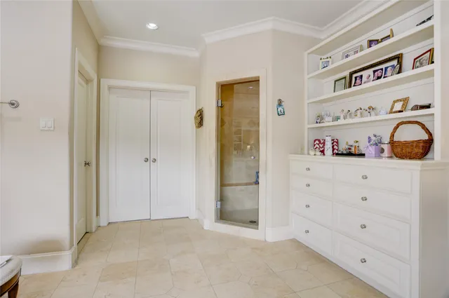 a view of walk in closet with clothes