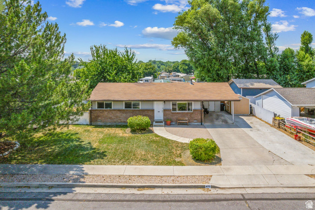495 North 250 West Springville, UT 84663 - Photo 25 of 35 Single story home with brick siding, concrete driveway, and an attached carport