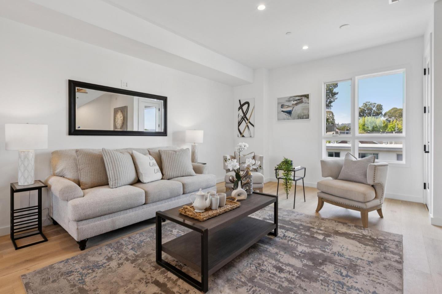 1433 Floribunda Avenue, Unit 5 Burlingame, CA 94010 - Photo 17 of 58 a living room with furniture and a rug