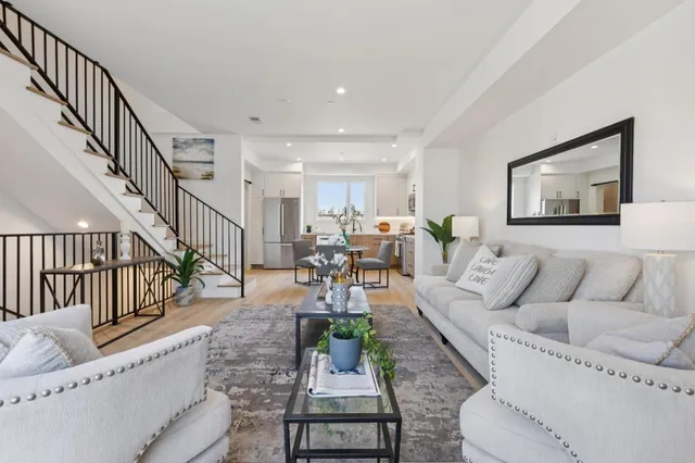 a dining room with furniture and wooden floor