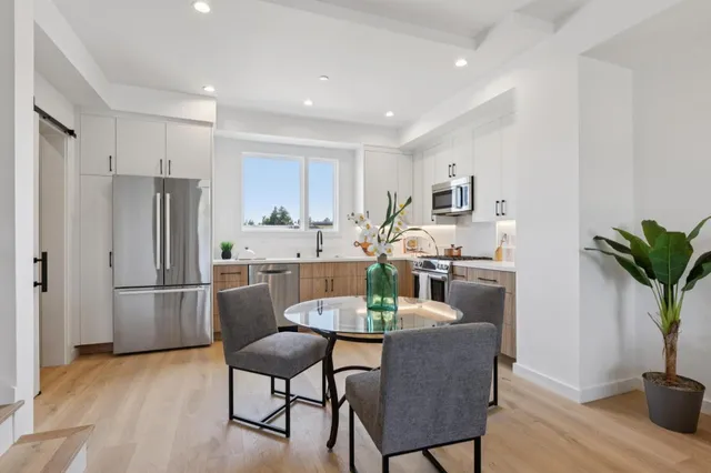 a kitchen with a sink stove and cabinets