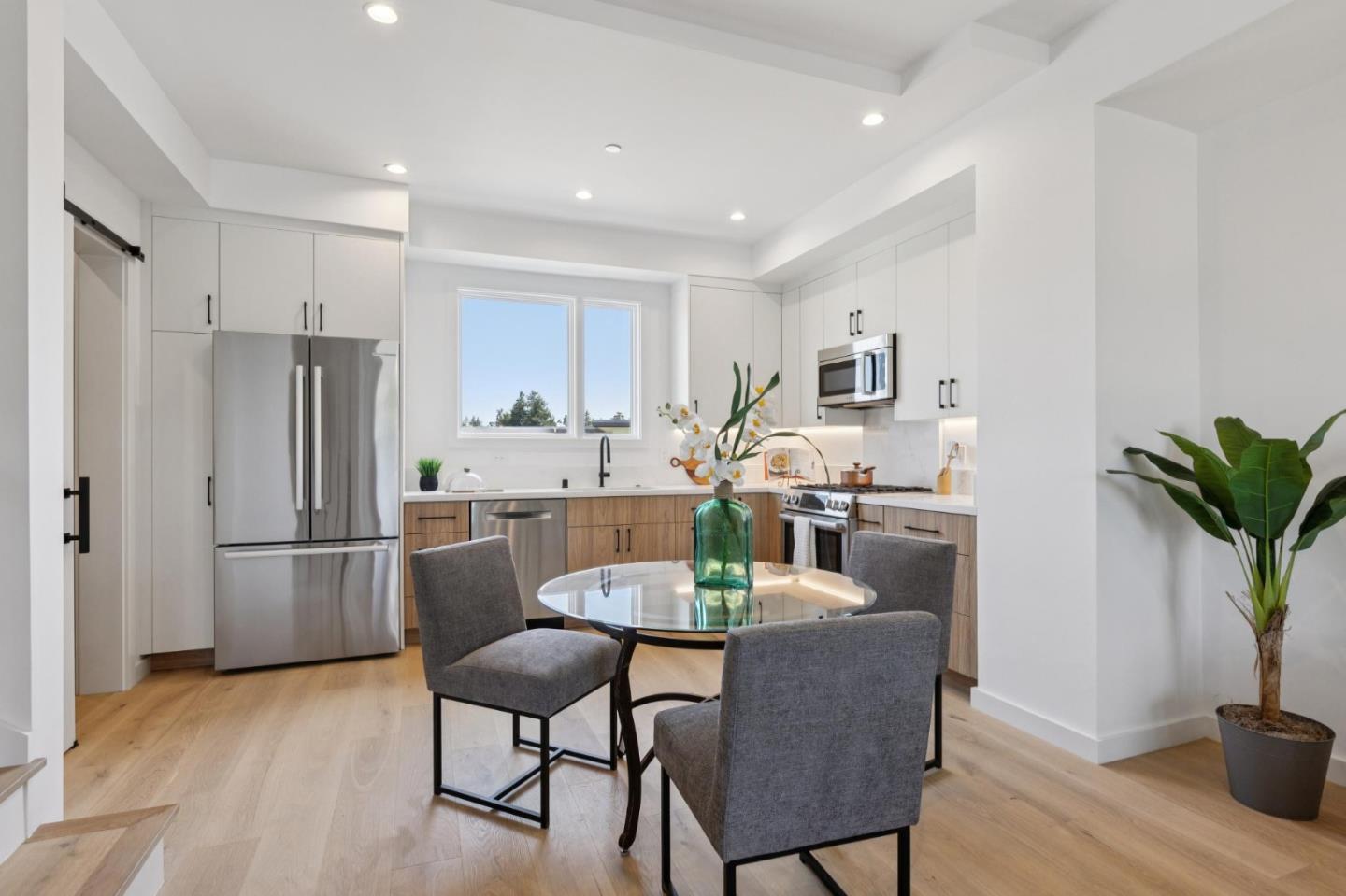 1433 Floribunda Avenue, Unit 5 Burlingame, CA 94010 - Photo 21 of 58 a dining room with furniture and wooden floor