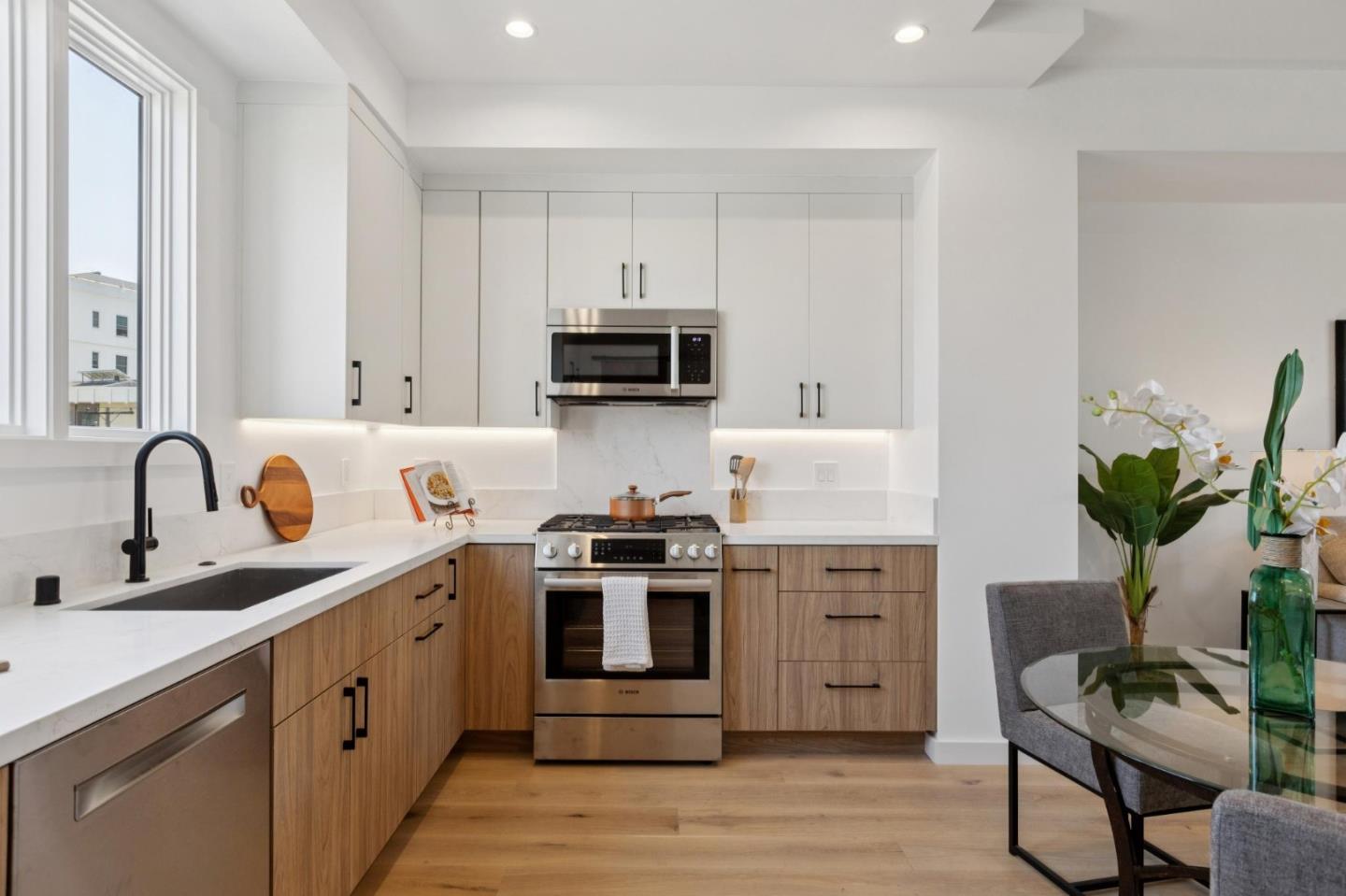 1433 Floribunda Avenue, Unit 5 Burlingame, CA 94010 - Photo 22 of 58 a kitchen with appliances a sink and cabinets