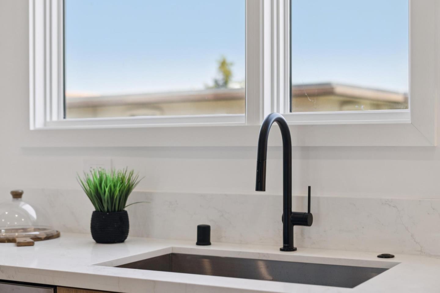 1433 Floribunda Avenue, Unit 5 Burlingame, CA 94010 - Photo 24 of 58 a view of a sink with a potted plant
