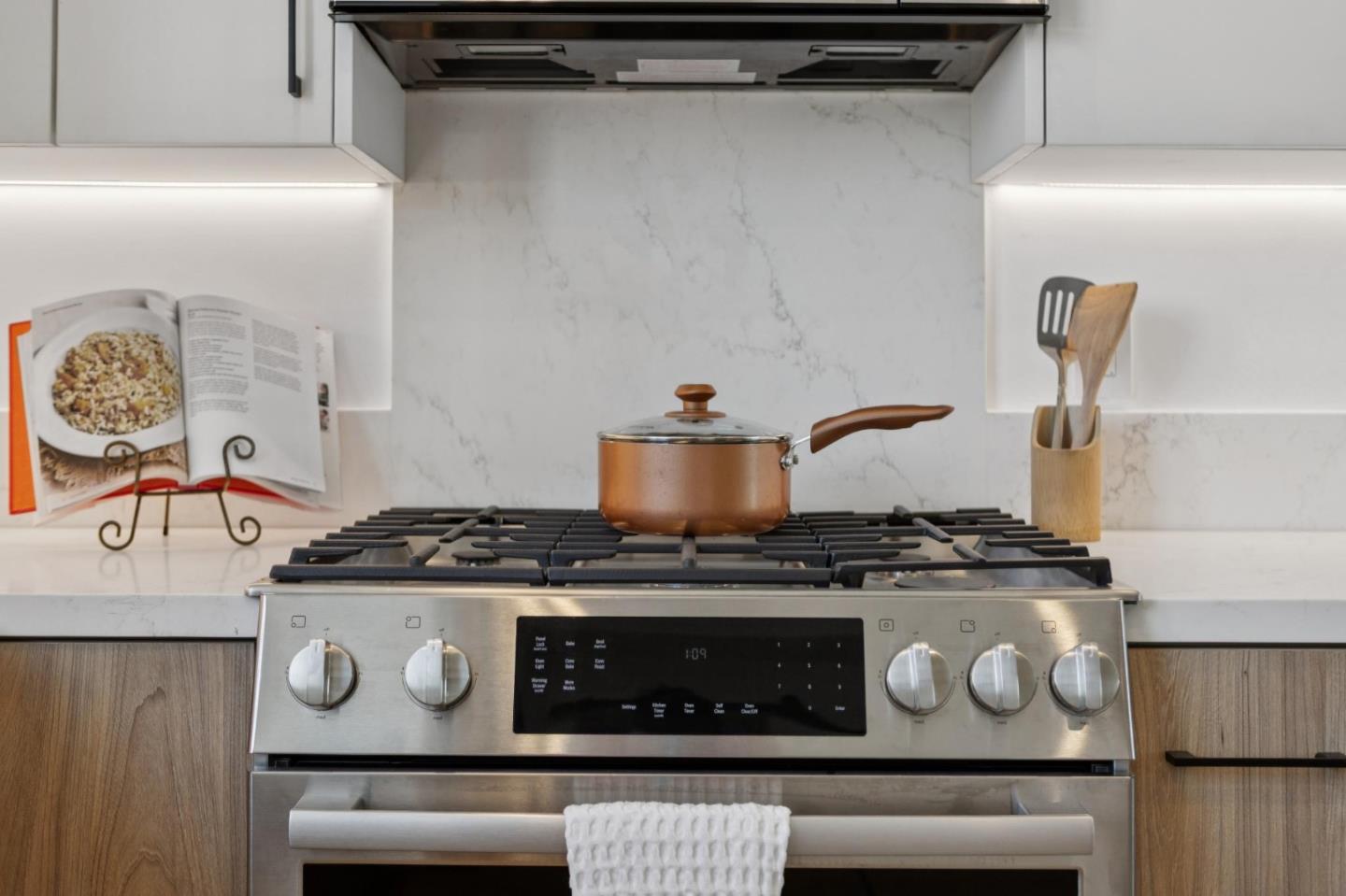 1433 Floribunda Avenue, Unit 5 Burlingame, CA 94010 - Photo 25 of 58 a stove top oven sitting inside of a kitchen