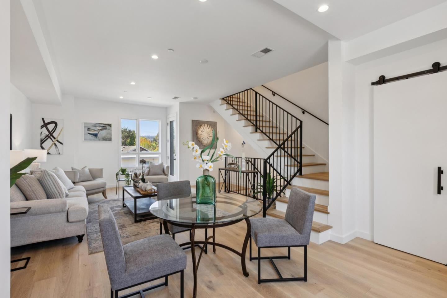 1433 Floribunda Avenue, Unit 5 Burlingame, CA 94010 - Photo 26 of 58 a living room with furniture and a wooden floor