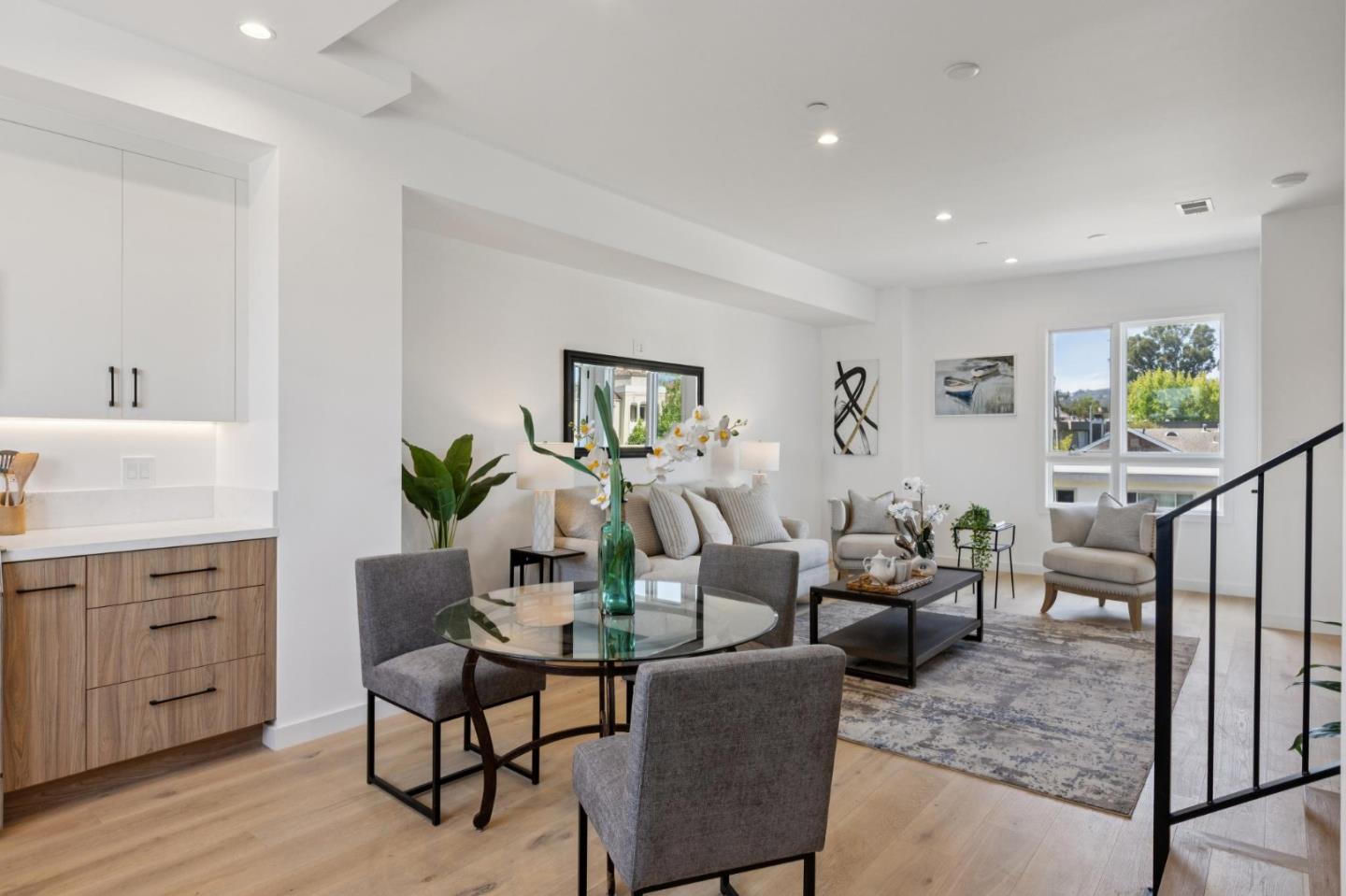 1433 Floribunda Avenue, Unit 5 Burlingame, CA 94010 - Photo 27 of 58 a living room with furniture a potted plant and open kitchen view