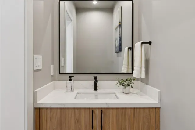 a bathroom with a sink and a mirror