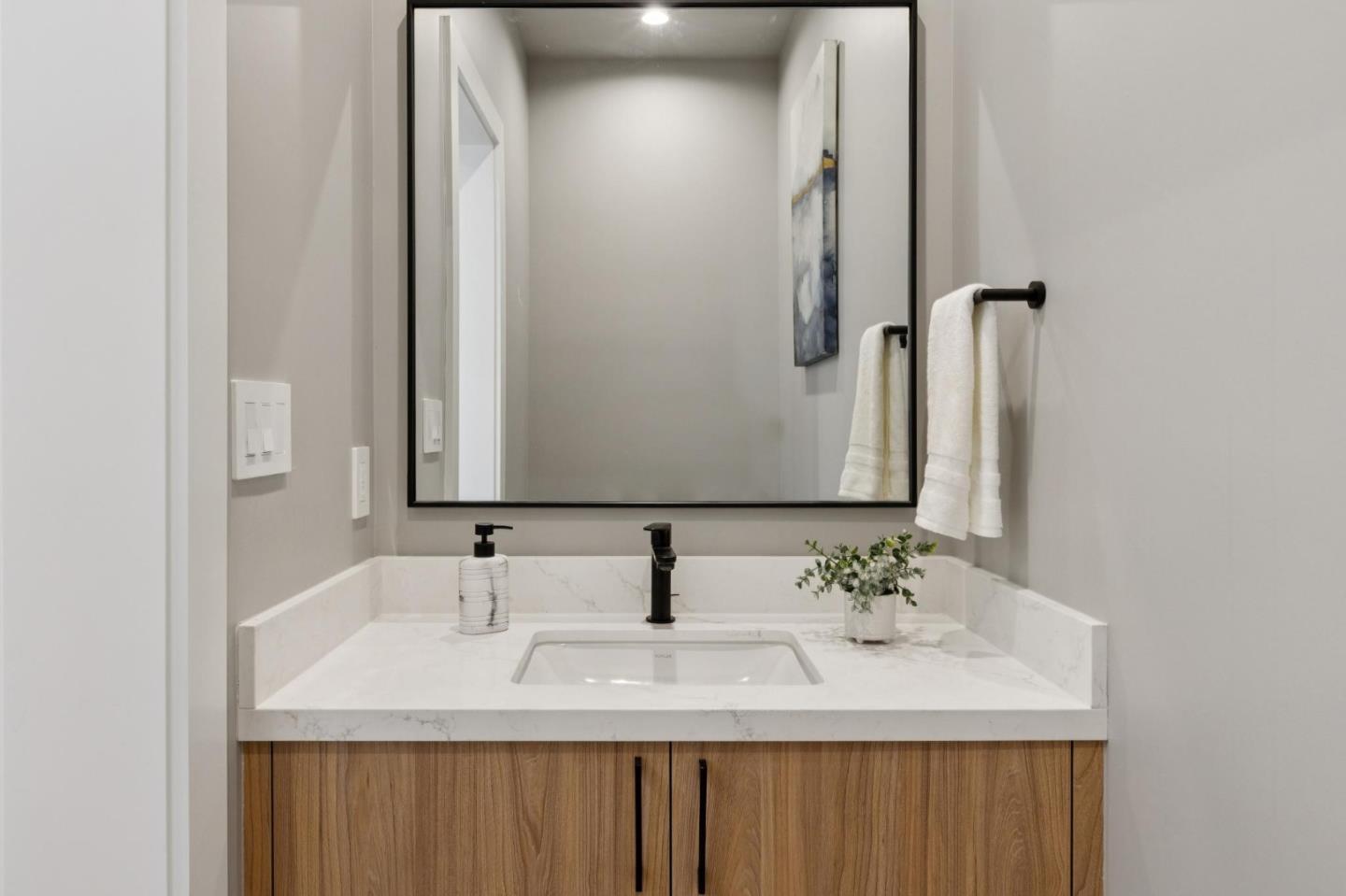 1433 Floribunda Avenue, Unit 5 Burlingame, CA 94010 - Photo 28 of 58 a bathroom with a sink and a mirror