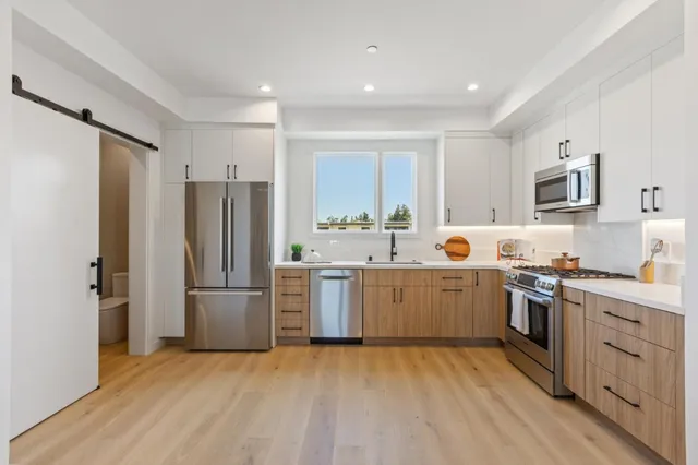 a view of a porch with furniture and a gate