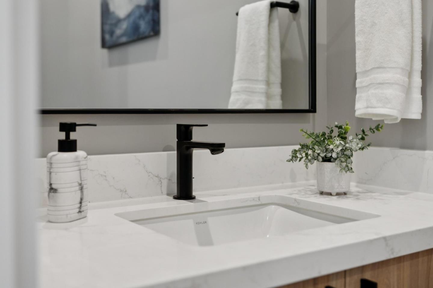 1433 Floribunda Avenue, Unit 5 Burlingame, CA 94010 - Photo 30 of 58 a bathroom with a sink and a mirror