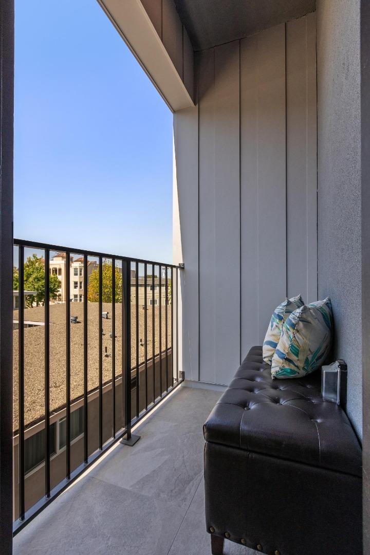 1433 Floribunda Avenue, Unit 5 Burlingame, CA 94010 - Photo 32 of 58 a bed sitting in a bedroom next to a window