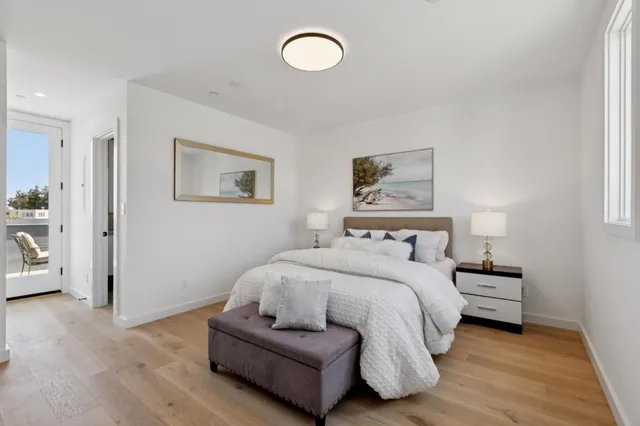 a spacious bedroom with a bed and a window