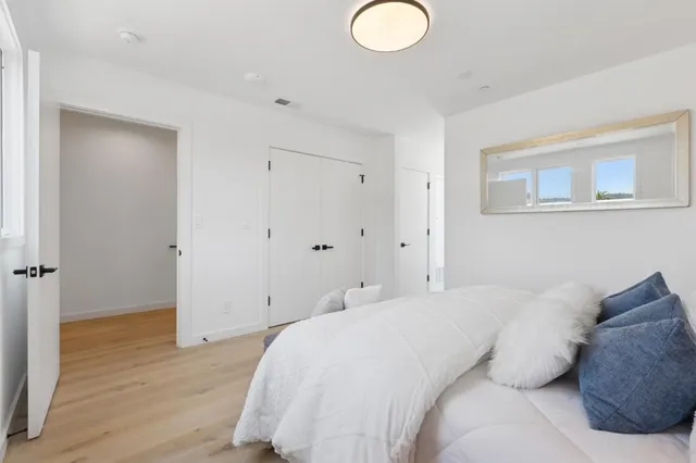 a bathroom with a shower sink and mirror