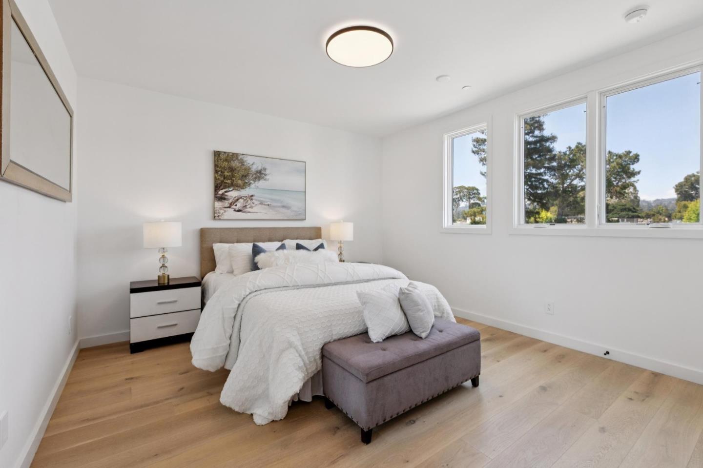 1433 Floribunda Avenue, Unit 5 Burlingame, CA 94010 - Photo 36 of 58 a spacious bedroom with a bed and a window