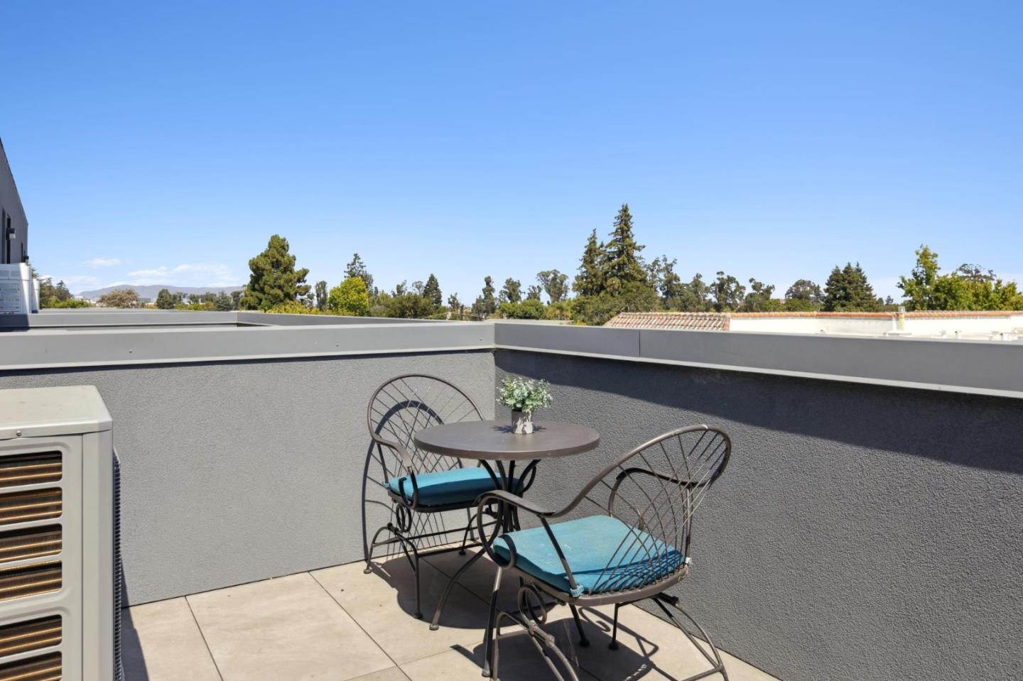 1433 Floribunda Avenue, Unit 5 Burlingame, CA 94010 - Photo 40 of 58 a view of a chairs and table in patio