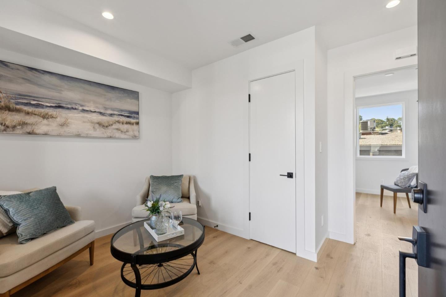 1433 Floribunda Avenue, Unit 5 Burlingame, CA 94010 - Photo 5 of 58 a living room with furniture and a potted plant