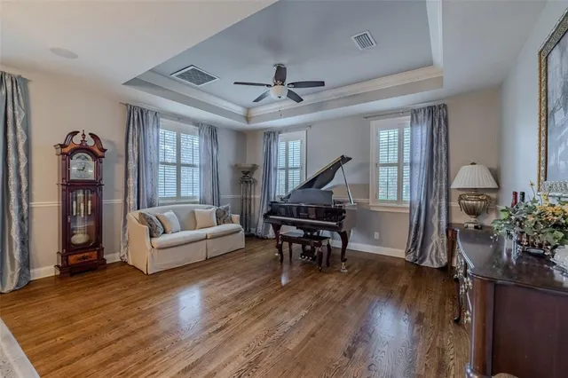 a living room with furniture and a kitchen view